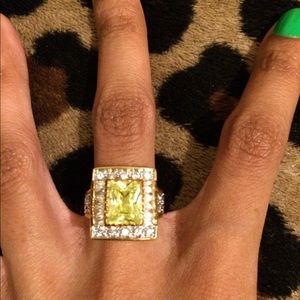 A faux green gemstone ring.